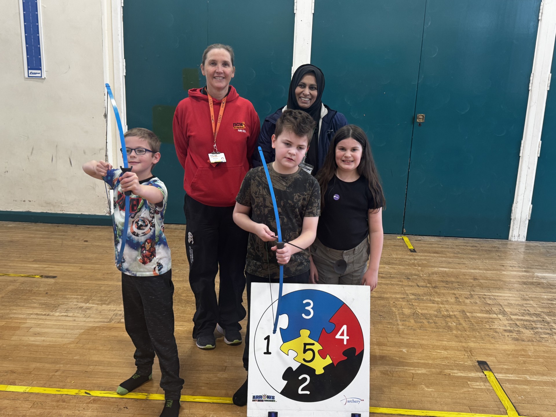 Blind students try archery at college event