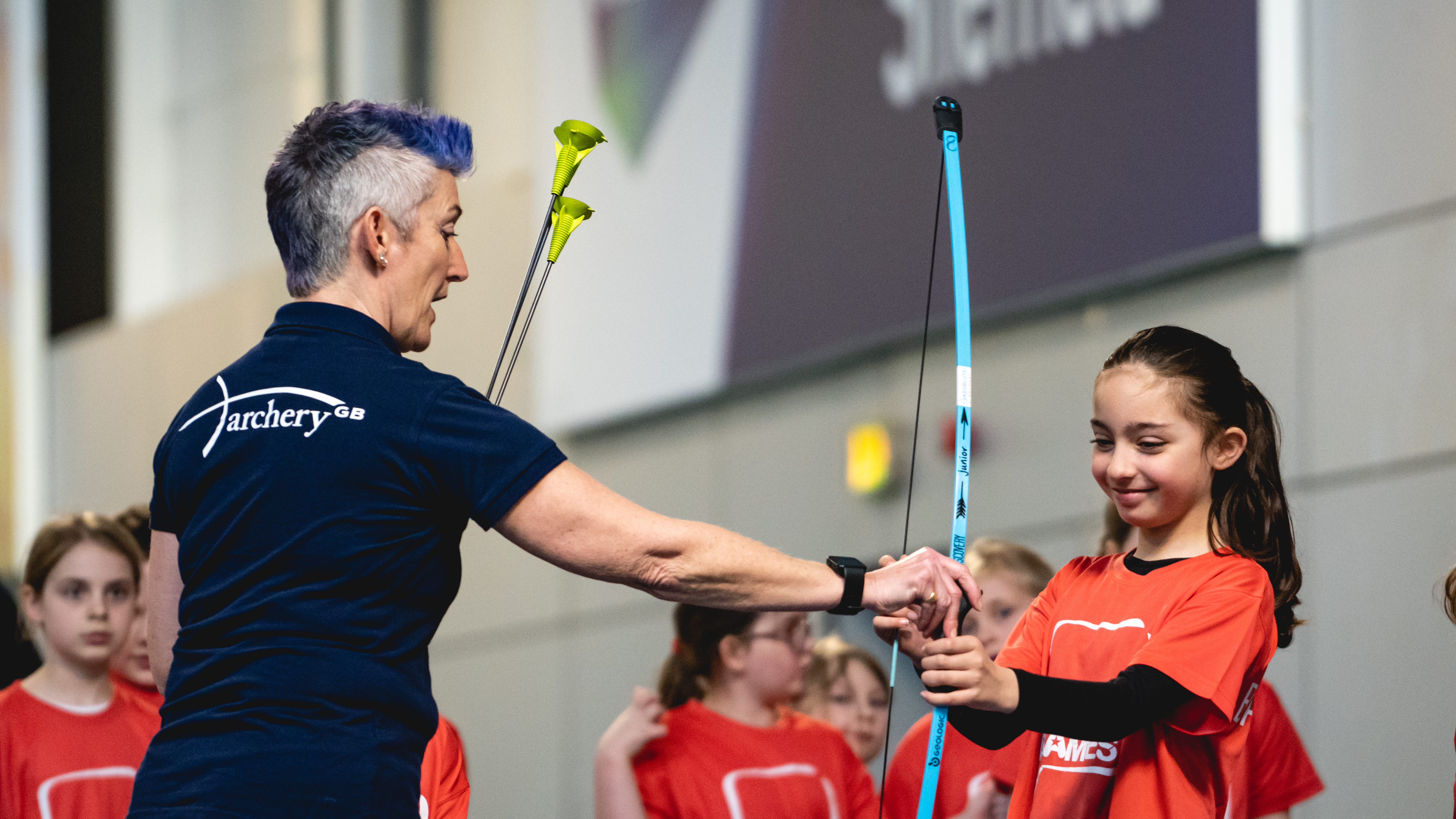 Girl trying soft archery