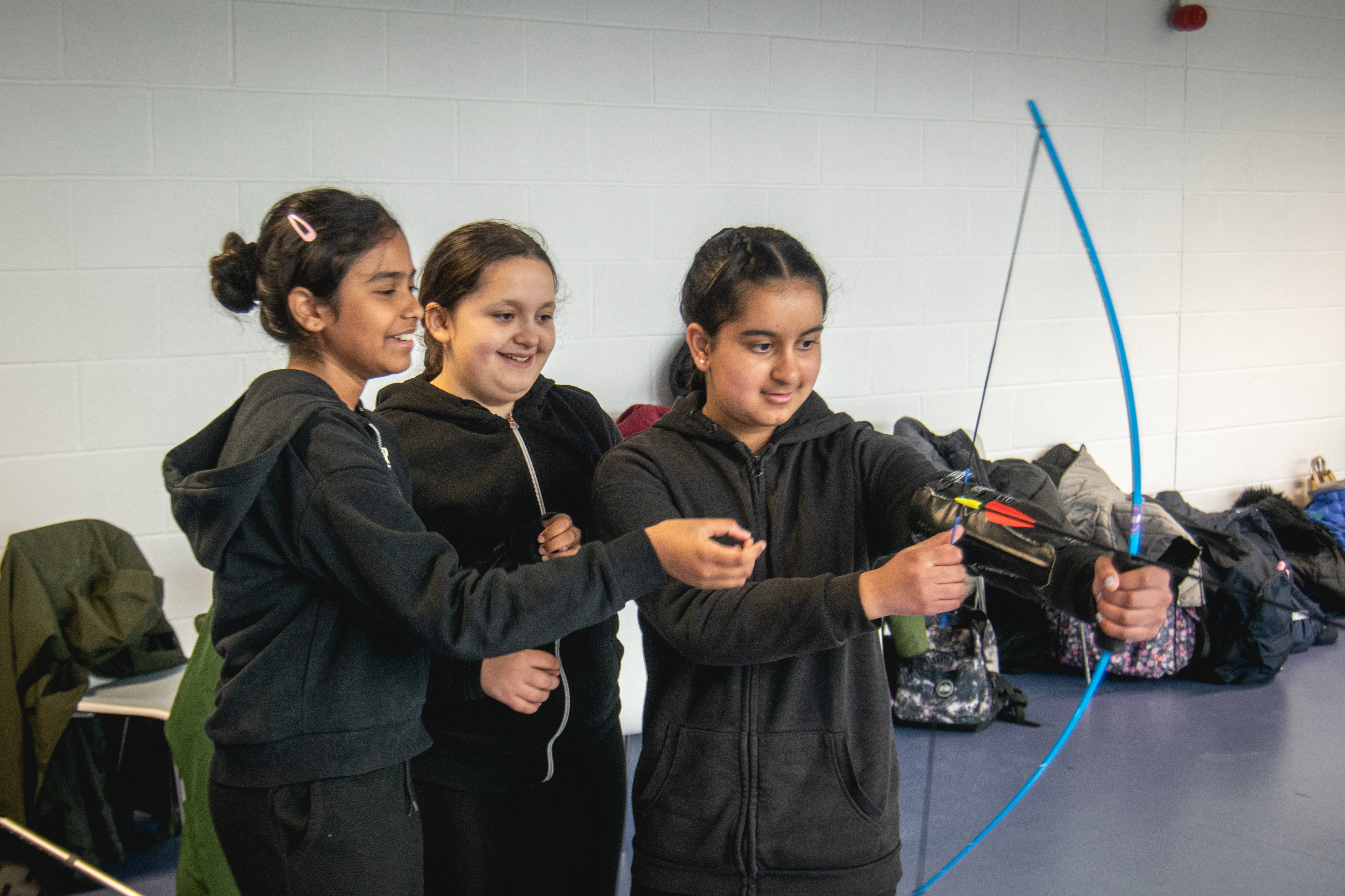 Young people doing soft archery