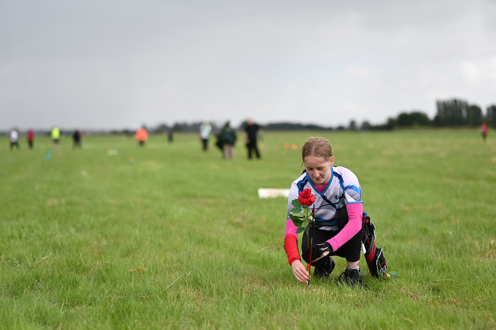 Girl marking a flight arrow