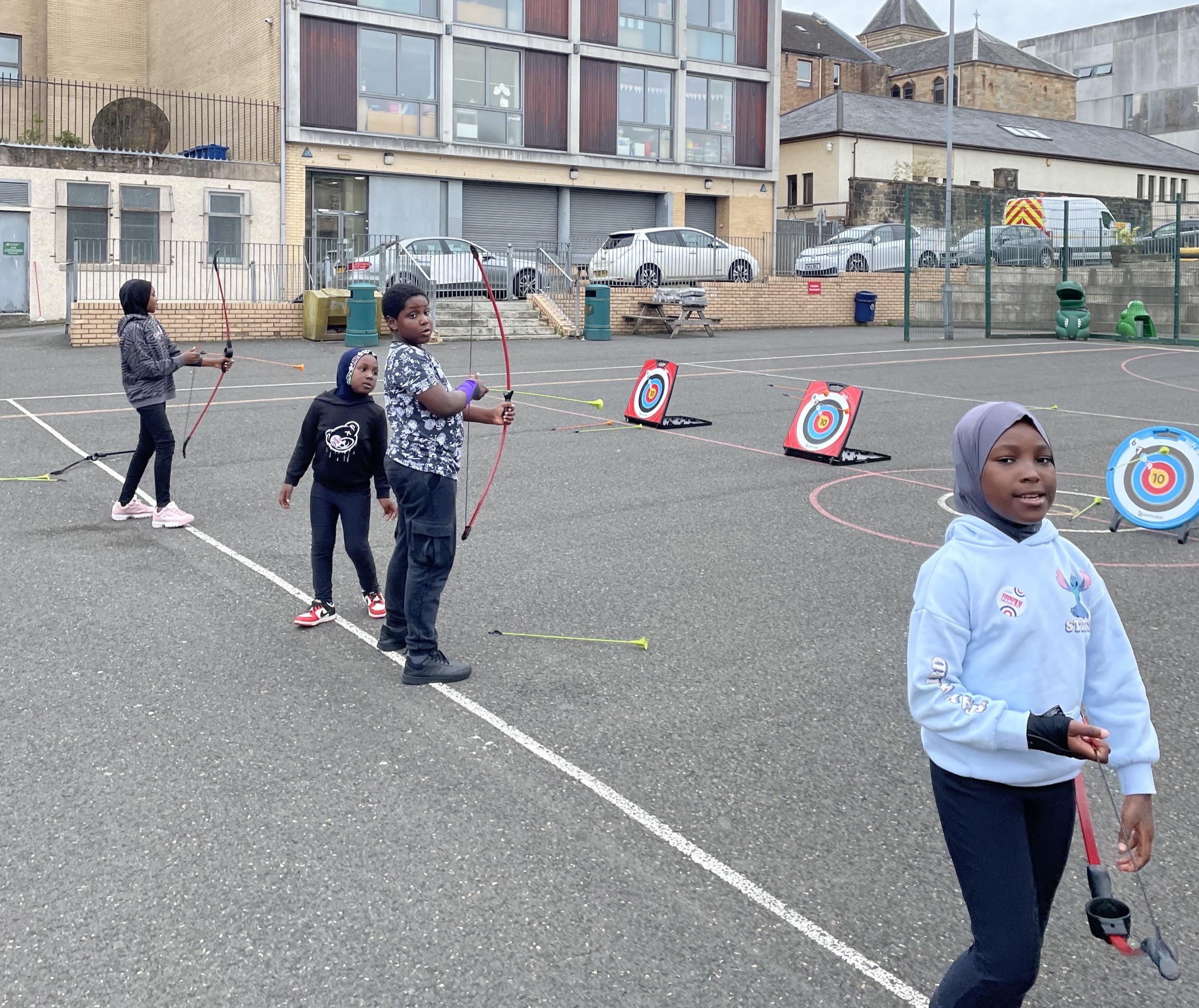 Young people trying soft archery