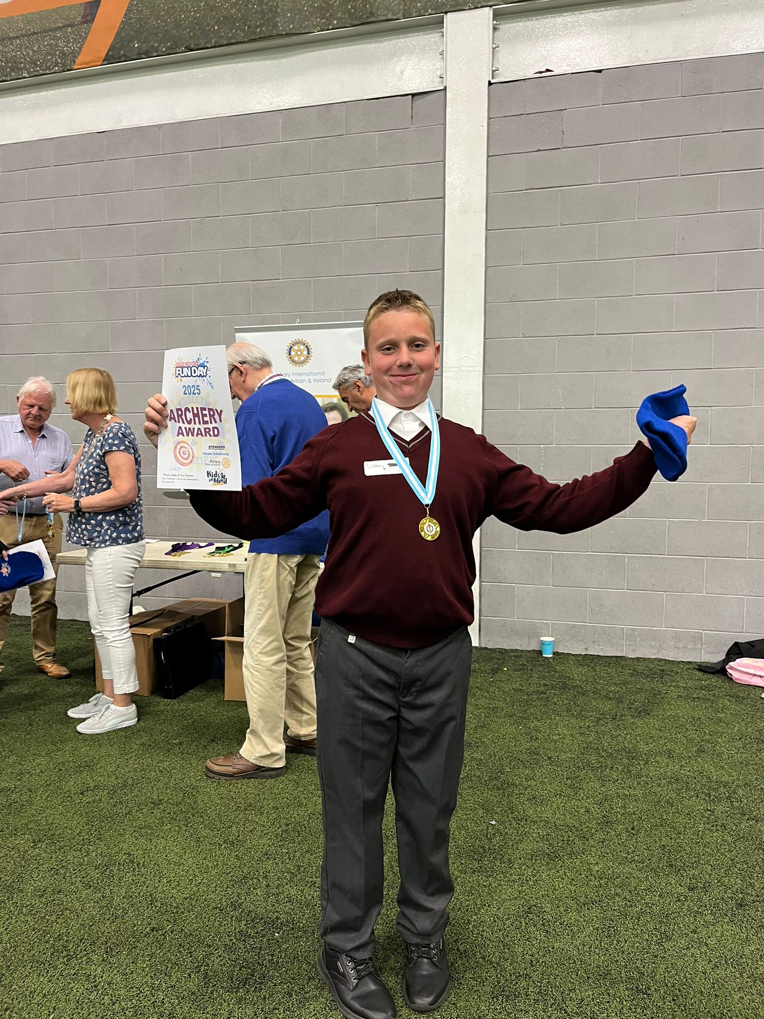 Student smiling and wearing a medal at the fun day