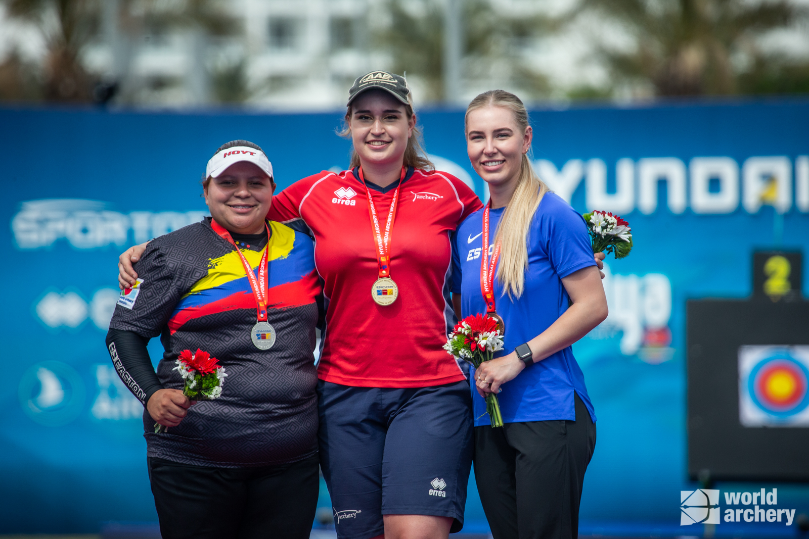 Ella Gibson on the podium after winning gold in the compound women's individual